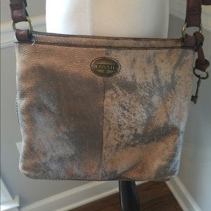 (1501).  Fossil crossbody bag.